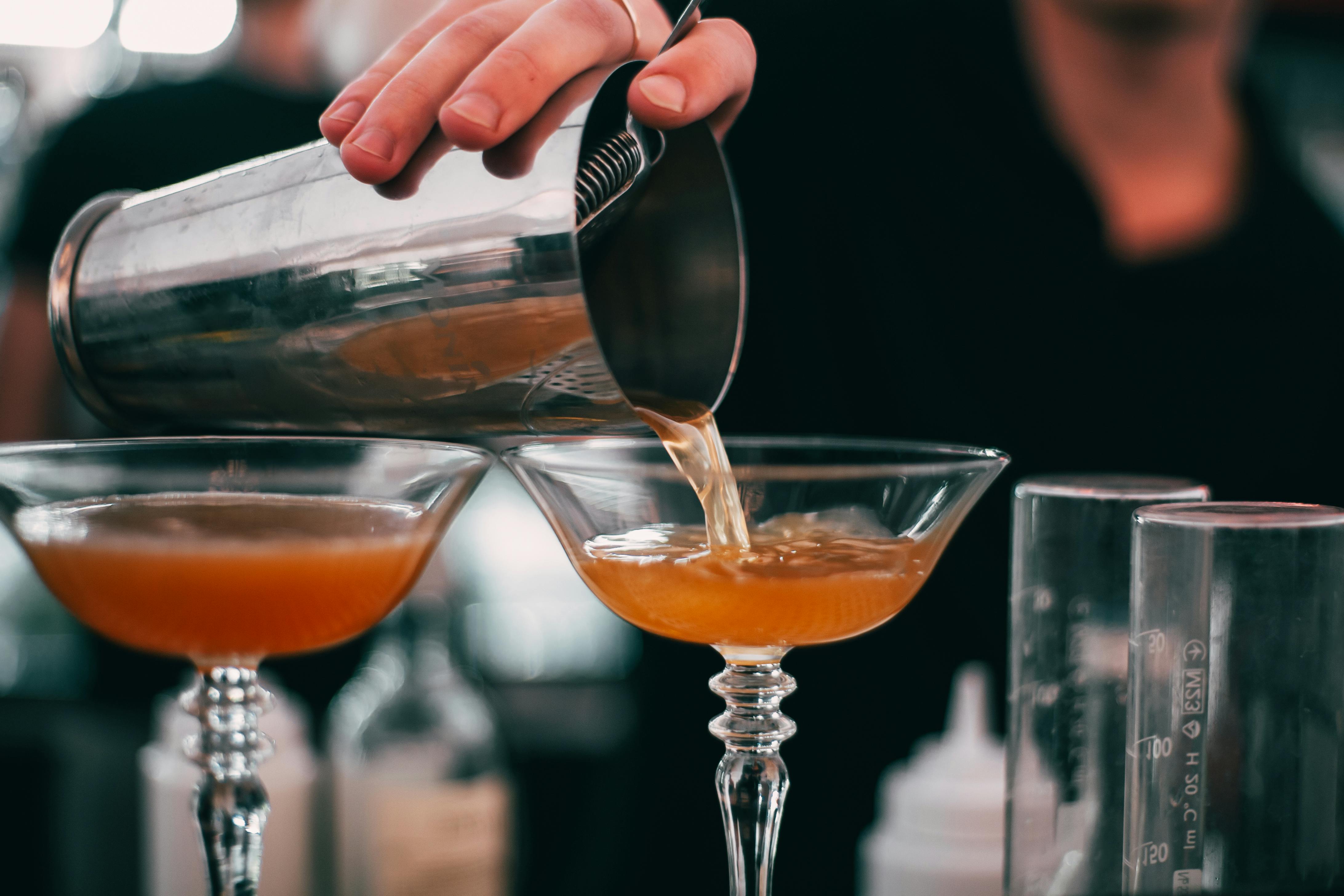 Bartender crafting artisan cocktail at Colombo rooftop bar